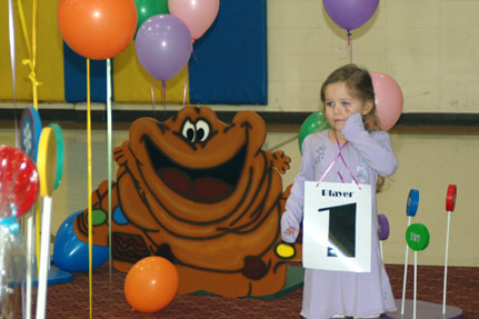 Little Girl Next to Candy Land Creature
